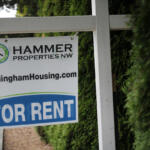 For rent sign posted by Hammer Properties NW, featuring BellinghamHousing.com on the sign.