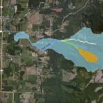 Aerial map of the Swift Creek watershed near Nooksack, showing floodplain in light blue and a large orange-yellow area to the east.