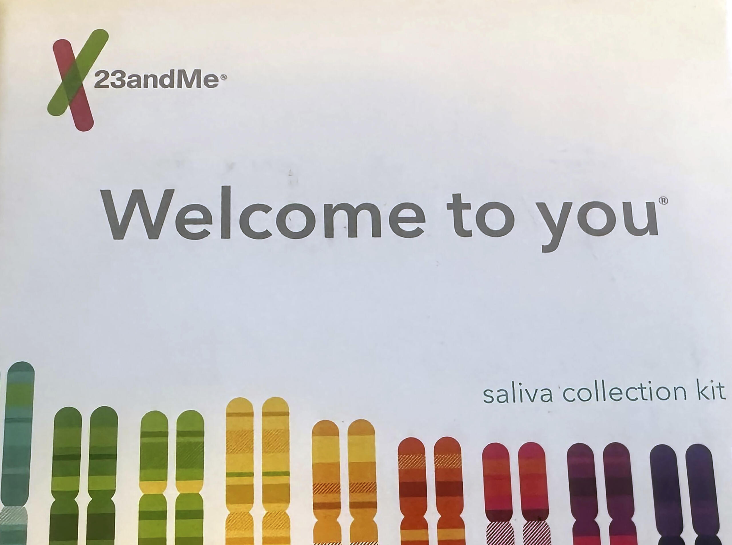 23andMe logo with the words 'Welcome to you' and a rainbow of vertical color bars beneath.