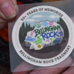 Circular sticker celebrating Bellingham Rock Fragment; graffiti-style rock with 'Go Hawks!', 'Congrats Grad!', and 'Rock ’15' in a forest scene; outer edge reads '50+ Years of Memories'
