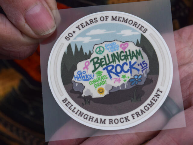 Circular sticker celebrating Bellingham Rock Fragment; graffiti-style rock with 'Go Hawks!', 'Congrats Grad!', and 'Rock ’15' in a forest scene; outer edge reads '50+ Years of Memories'